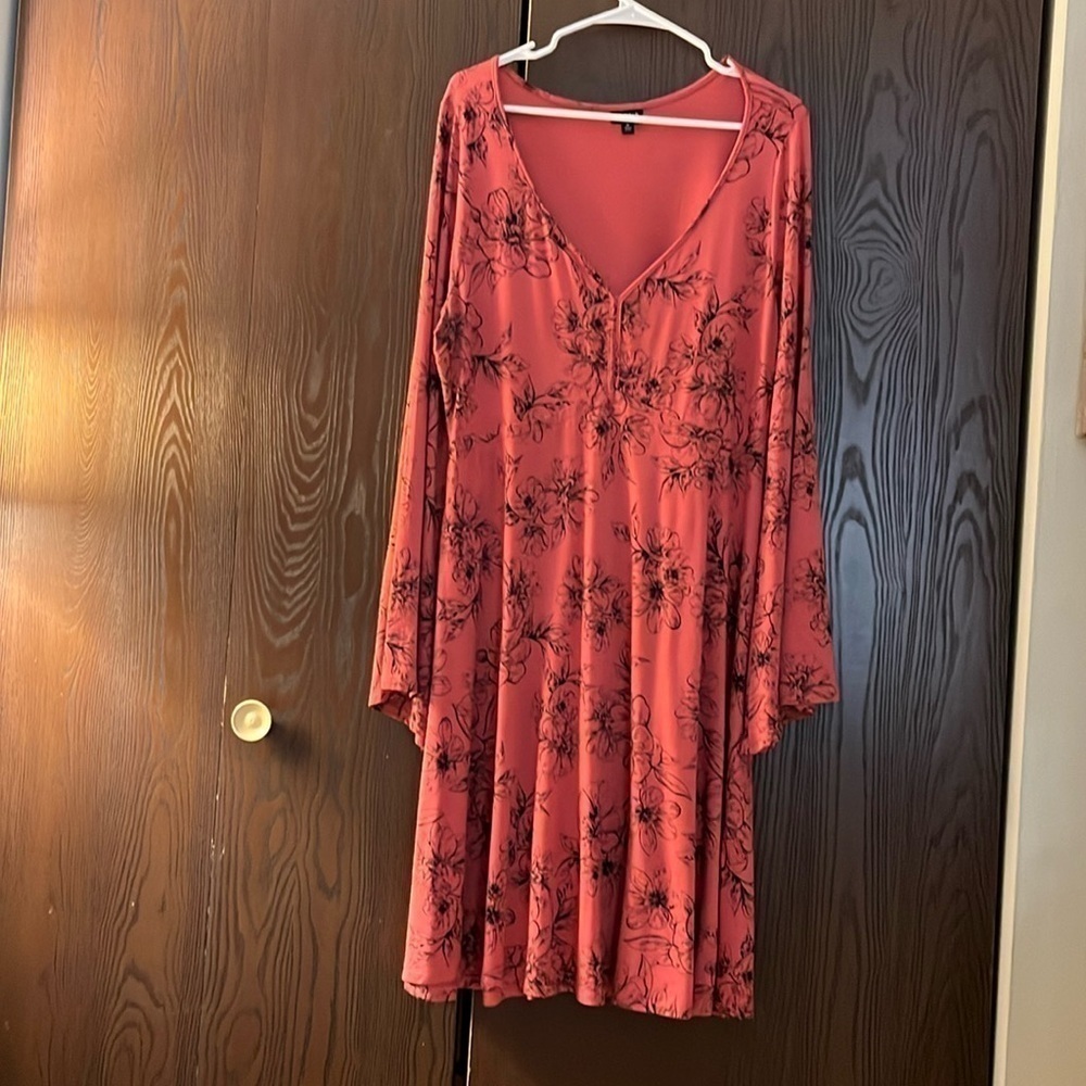 Torrid long sleeved dark orange dress with black floral patterns. Size Torrid 0.
